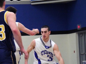 St. Chris Cyclones guard Mike Rocca dribbles around screen in action earlier this season. (PAUL OWEN, The Observer)