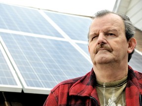 George Corkum, said little power is being generated by the solar panels installed on the roofs of his two homes in November 2012. Corkum, who still has mortgage payments on his two homes, said he's headed for bankruptcy. (DIANA MARTIN, The Daily News)