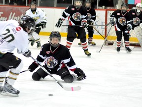 The Northern Ontario Hockey Association Tournament of Champions is underway at the McItnyre Arena this weekend, with the best novice 'AA' and peewee 'AA' teams competing for a berth in the Ontario Hockey Federation championship in April. Mikey's Timmins peewee North Stars skater Joshua Boutin hesitates to let a shot go, as a Nickel City Rebels player lays it all on the line in the third period of the tilt on Friday.