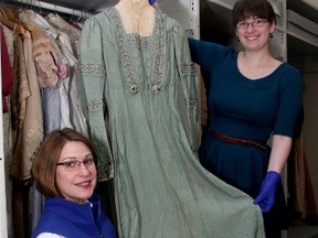 Patricia Ewer (left) and Brenna Cook with a vintage dress which is part of a collection in the vault at the Agnes Etherington Art Centre.
Ian MacAlpine The Whig-Standard