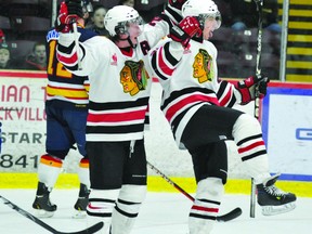 Brockville Braves forward Erik Brown celebrates his first-period goal with teammate Hayden Hulton (22) during the team's 6-2 win over the Hawkesbury Hawks on Friday night at the Memorial Centre. (STEVE PETTIBONE The Recorder and Times)