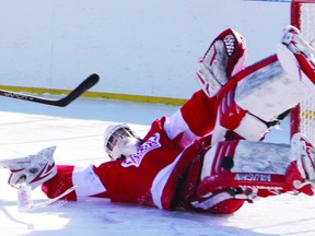 Pembroke Lumber Kings' goalie Darren Smith stacks the pads to make a save during the team's recent outdoor practice. The Barrie native was recently named the league's rookie of the month for January and has now been named the Central Canada Hockey League Corporate Hype player of the week.
