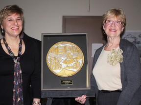 Timmins potter and artist, Mira Buchar, left, designed the Spirit of Schumacher award plaque, which was presented to author and historian Louise Nightingale Smith at Mr. Schumacher Day celebrations on Friday evening. The honour is bestowed upon a person in the community who has made a significant contribution to the arts, culture, heritage and spirit of Schumacher.