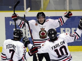 Tyler Prong, centre, celebrates his first period goal against the Leamington Flyers with teammates Jason Teschke, left, and Steve Farlow Saturday, March 2, 2013 at Sarnia Arena in Sarnia, Ont. PAUL OWEN/THE OBSERVER/QMI AGENCY