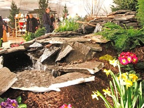 An attractive and colourful water feature from Richard's Lawn and Garden Care was a welcome sight for the winter-weary crowd at the Rotary Complex this weekend for the 13th annual Stratford Garden Festival. MIKE BEITZ The Beacon Herald