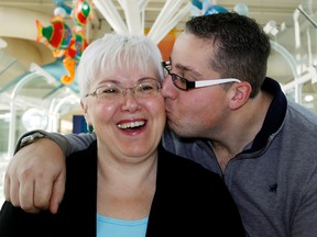 Jason Ethier and Shelia Ethier gives his mom a big kiss on the cheek at the Stollery Children's Hospital in Edmonton Alta. Jason was diagnosed at age two with T-Cell leukemia in 1987 and has had a life of struggles as he has survived though many health related ordeals. Sheila never gave up and has been at his side the whole way. Tom Braid/Edmonton Sun/QMI Agency