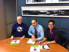 Timmins Coun. Todd Lever, centre, filling in as acting mayor, signed a proclamation marking March 26 as Purple Day in the City of Timmins. The day is aimed at increasing awareness of epilepsy and dispelling many of the myths associated with the disease. Also attending the proclamation ceremony were Seizure and Brain Injury Centre president Jacques Arbic and executive director Rhonda Latendresse.