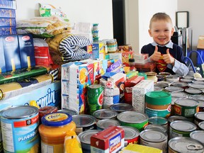Four-year-old Hayden Cameron of Timmins is proud of the impressive stack of non-perishables he has collected over the past two weeks for the Timmins Food Bank. Hayden came up with the idea after he realized he didn’t have to wait for anyone to tell or ask him to help out families less fortunate than his.