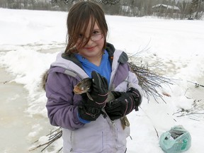 Meadow Summerfield, 10 with the fish she caught Tuesday on Otto Lake at Culver Park in Swastika.