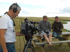 JR Comstock/Handout/QMI Agency
Lifelong friends JR Comstock (C) Chris Koch (R) are shown at Pine Coulee near Stavely, Alberta filming a video in a summer 2011 handout photo. The pair are trying out for Amazing Race Canada. Koch was born without arms or legs but doesn’t let that slow him down one bit. The show films sometime in May.