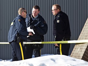 Police are on scene at the court house after two gunmen opened fire on a sheriff in the building before fleeing in Whitecourt, on Tuesday, Feb. 26, 2013. The suspects were apprehended shortly after. See pages 3-5 for more coverage.
Codie McLachlan | QMI Agency