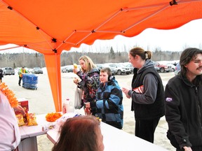 Santana, Elijah and Tammy Rivard enjoy a hot dog lunch on Friday, March 1. Walmart held a fundraising barbecue on March 1 to help raise money for the Breakfast Clubs of Canada.
Barry Kerton | Whitecourt Star