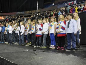 The Sangudo Community School Choir perform O Canada at an Oil Kings game at Rexall Place in Edmonton on Wednesday, Feb. 20.