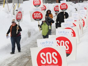 Supporters participate in the Save Our Services Day of Action rally outside Health Sciences North in Sudbury, ON. on Monday, March 4, 2013. Similar rallies were being held at many locations throughout Ontario.