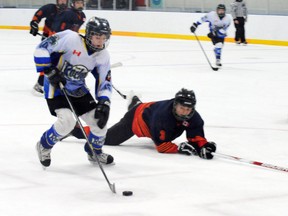 MONTE SONNENBERG Simcoe Reformer
Ben Sherman of the Delhi Legion peewees brings the puck up ice Saturday during Game 2 of the OMHA C series against the North Middlesex Stars. Delhi won the game 3-2 and Game 3 3-0 on Sunday to advance to the all-Ontario final next week.