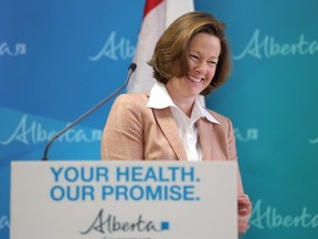 Alberta Premier Alison Redford acknowledges a standing ovation at the announcement of a new cancer facility at the Foothills Medical in Centre Calgary, Alberta, on March 1, 2013. Mike Drew/Calgary Sun/QMI AGENCY
