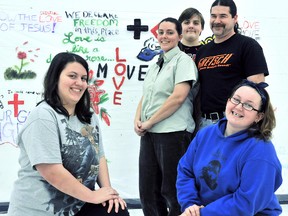 The Chatham Salvation Army youth group, Connexions, will be participating in an Amazing Race style event highlighting child poverty as part of a new Global program called Love is Moving airing in April.  Connexion youth group members Elizabeth Shaw, 15, left, Jacob Shaw, 12, back centre, and Katie Wright, bottom right, will participate in the program under the supervision of Nicole Shaw, Salvation Army youth co-ordinator, standing left, and volunteer Dave Howard, standing right. (DIANA MARTIN, The Daily News)