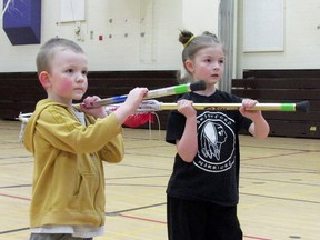 Contributed Photo
Helmi and Onni Virtasalmi try their hand at lacrosse during a free try out of the sport March 1 at Waterford District High School. The Norfolk Timberwolves will continue to hold free lacrosse open houses and registration on March 8 and 22.