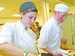 Fanshawe culinary student Saida Sayd competes in Fanshawe College?s Iron Chef competition alongside her chef partner Robert Stewart at the school. This pair won top honours while Sayd also won gold for her sugar show piece at the Canadian Restaurant and Foodservices Association show in Toronto. (MIKE HENSEN The London Free Press)