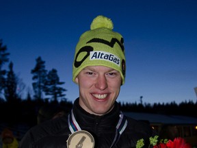 Mark Arendz shows off one of the several gold medals he collected this season. Supplied by Biathlon Canada