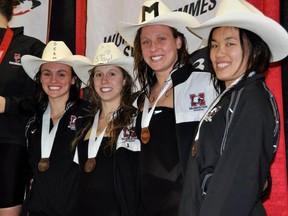 McMaster's 4x100-metre freestyle relay team on the podium at the CIS championships in Edmonton -- Emma Mittermaier, Sarah Taylor, Meg Sloan and Emily Fung. CONTRIBUTED