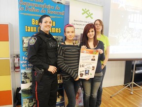 Const. Melanie Labelle stands with CCVS students Hannah Kingston and Tianna Lalonde, as well as Boys and Girls Club staff member Kari-Anne McKellar, at the launch of the 9th Cops and Rockers event March 5, 2013 in Cornwall, Ont.
Staff photo/KATHRYN BURNHAM