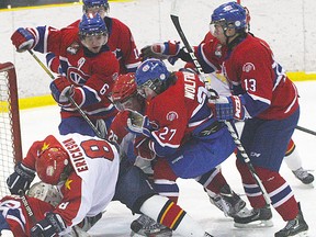 Evan Erickson of the Wellington Dukes crashes the Kingston Voyageurs net during OJHL playoff action Tuesday night at Essroc Arena. (Bruce Bell/The Intelligencer.)