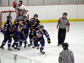 Adam Durkee leads the Fort McMurray Oil Barons goal procession after converting on the powerplay at 10:47 of the first period in game two of the Best of Five series between the Barons and the Whitecourt Wolverines Tuesday night in Whitecourt.  TREVOR HOWLETT/TODAY STAFF