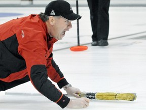 Winning skip John Young Jr. shouts instructions during the 'A' final in the Devolder Farms/Dekalb Chatham-Kent Major Curling League on Tuesday at the Chatham Granite Club. (MARK MALONE/The Daily News)