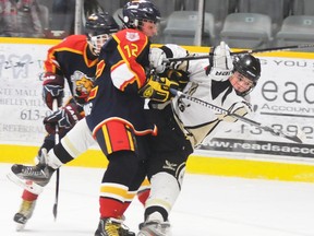 Barrie Colts' Kyle Furlong upsets Quinte West Rushnell Funeral Centre Major Bantam Hawks captain Matt Tedford during the Hawks' 4-0 win, Sunday at the Community Gardens.