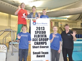 CBAC swimmers, from top left: Kayla Goruk (red shirt) Brock Hoel, Lincoln Hoel, coach Lynne Driessen, Alex Pratt and Parker Knibb celebrate their team’s fifth-straight small-team award.