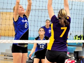 In this photo from the final NEOAA Senior Girls Volleyball Qualifying Tournament at Timmins High & Vocational School on Feb. 20, Sarah Smith, right, of the École secondaire L’Alliance Ours, goes high into the air to volley the ball over the attempted black of Hannah Knox, of the TH&VS Blues. The Blues, who represented NEOAA at the OFSAA ‘AA’ Girls Volleyball Championships in Ottawa, finished last in their pool with a record of 0-4. The Ours, who represented NEOAA at the OFSAA ‘A’ Girls Volleyball Championships in Lakefield, finished fourth in their pool with a record of 1-3.