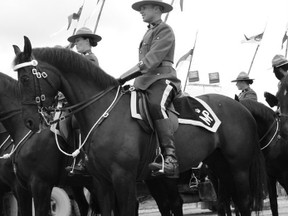 RCMP Const. James Guthrie and Anne perform in the Musical Ride at the 100th anniversary of the Calgary Stampede in 2012. SUBMITTED PHOTO