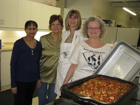 Members of the International Women's Day committee made chili for 300 on Wednesday at Woodstock and Area Community Health Centre. From left Nischa Gupta, Mary Anne daCosta, Heather Werby and Phyl McCrum. HEATHER RIVERS/WOODSTOCK SENTINEL-REVIEW