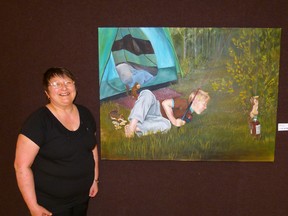 Janet Enfield and her painting "Pastime" of a boy fishing for squirrels