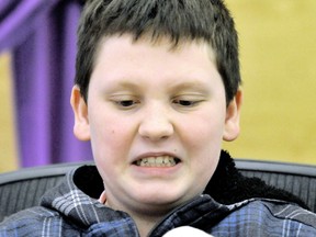 Konar Jones, 12, a Grade 7 student at St. Agnes Catholic School, feels the frustration rising as he attempts to screw a nut onto a bolt during a fine motor skills challenge at the St. Clair Catholic District School Board's annual accessibility plan student forum in Wallaceburg. PHOTO TAKEN Wallaceburg, on, Wednesday March 06, 2013. DIANA MARTIN/ THE CHATHAM DAILY NEWS/ QMI AGENCY