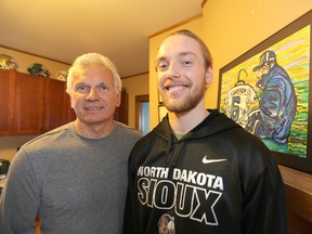 Brett Cameron (right), the son of CFL legend Bob Cameron (left), was signed to a contract by the Winnipeg Blue Bombers on Wed., March 6, 2013. Kevin King/Winnipeg Sun