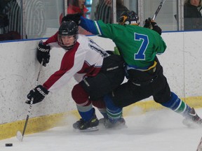 DARRYL G. SMART, The Expositor

Assumption's Austin Elkin breaks loose from a St. David defender Wednesday during the CWOSSA AAA/AAAA boys' hockey semifinal game in Kitchener.