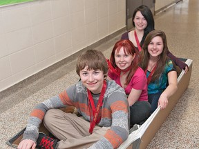 BRIAN THOMPSON, The Expositor

Woodman School students Carson Forbes (left), Autumn Pake, Julia Ayers and Thalia Bulanhagui sit in a replica of the cardboard boat they designed and built at a Skills Ontario competition in Waterloo last month. They won a gold medal.