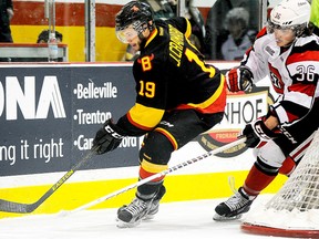 Belleville Bulls forward Joseph Cramarossa gets chased behind the Ottawa net by 67's forward Taylor Fielding during OHL action Wednesday night at Yardmen Arena. (Michael J. Brethour for The Intelligencer.)