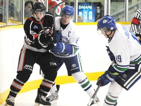 Yan Kalashnikov of the Soo Thunderbirds fights for position with Sebastien Leroux of the Sudbury Nickel Barons as Nickel Barons Martin Jolicoeur makes a play for the loose puck during first period NOJHL action from the McClelland Arena on Wednesday night.The Thunderbirds defeated the Nickel Barons 4-0.

GINO DONATO/THE SUDBURY STAR