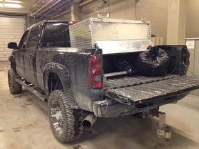 One of two pickup trucks seized at the port of entry on Feb. 7 with fine cut tobacco hidden in a fake gas tank compartment.