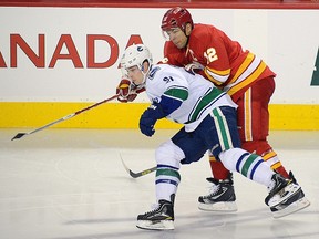Mason Raymond cuts in front of Flames captain Jarome Iginla during the Mar. 3 game at the Saddledome.