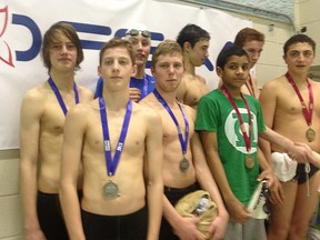 The St. Thomas Aquinas swim team is presented with their silver medals for the 4X100 Men’s Open relay. The first-ever Saints swim team was composed of Conor O’Flaherty, Bryn Jones, Bryce Jones and Jarrett Weedon.
STEVE MASTROMATTEO PHOTO