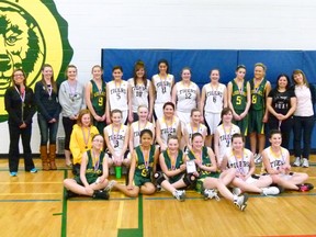 Winners in the 1J Girls Zones tournament - the first place St. Thomas More Kodiaks (in green) and the second place Hines Creek Tigers (in white). Kodiaks’ coach Toni Craig is on the far left, Tigers’ coach Jennifer Kramer second from the right. The Kodiaks took the win 51-33.