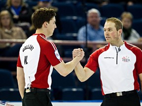 Brett Gallant (left) and Beaverlodge’s Geoff ‘Texas Ranger’ Walker of Team Newfoundland and Labrador celebrate their win over British Columbia during the 2013 Tim Hortons Brier at Rexall Place in Edmonton. (Codie McLachlan/QMI Agency)