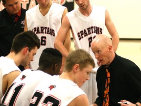 SPA head coach Chris Delano goes over a play with members of his team during action in the EPSL this winter. Gord Montgomery/QMI Agency