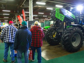 Large crowds and large machinery are par for the course during the 75th annual Farm Show being held this week at the Western Fair Progress building and the Agriplex. MIKE HENSEN/The London Free Press/QMI AGENCY