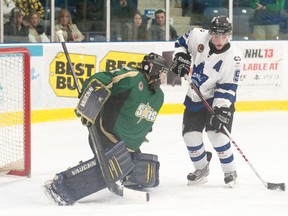St. Thomas goaltender Donald Edwards takes care of business against London's Noah Schwartz during Wednesday's 1-0 overtime victory for the Stars. CRAIG GLOVER QMI Agency