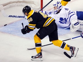 Boston Bruins centre David Krejci puts the puck past Maple Leafs goaltender Ben Scrivens for a goal during the second period last night. With their win, Boston is now 8-0-1 in the past nine meetings, including 4-0 at home. They’ve outscored Toronto 21-5. (REUTERS)